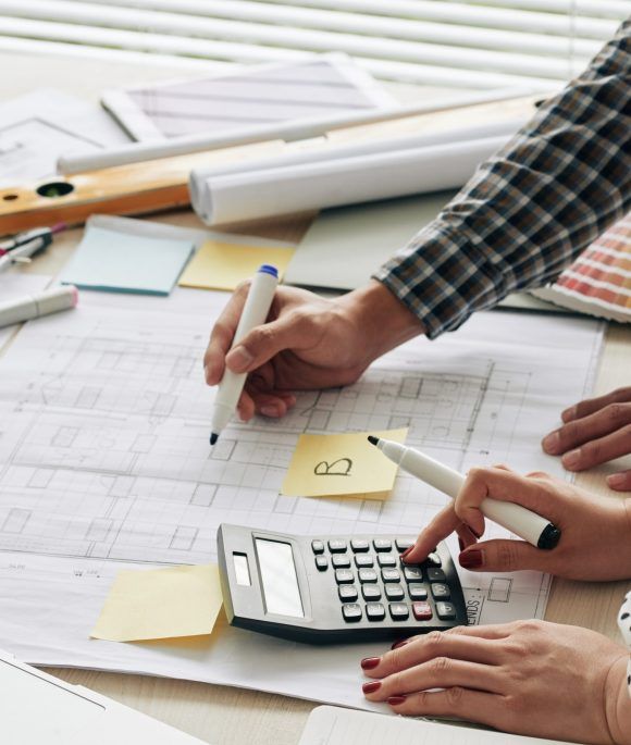 Hands of architecs counting budget for the project